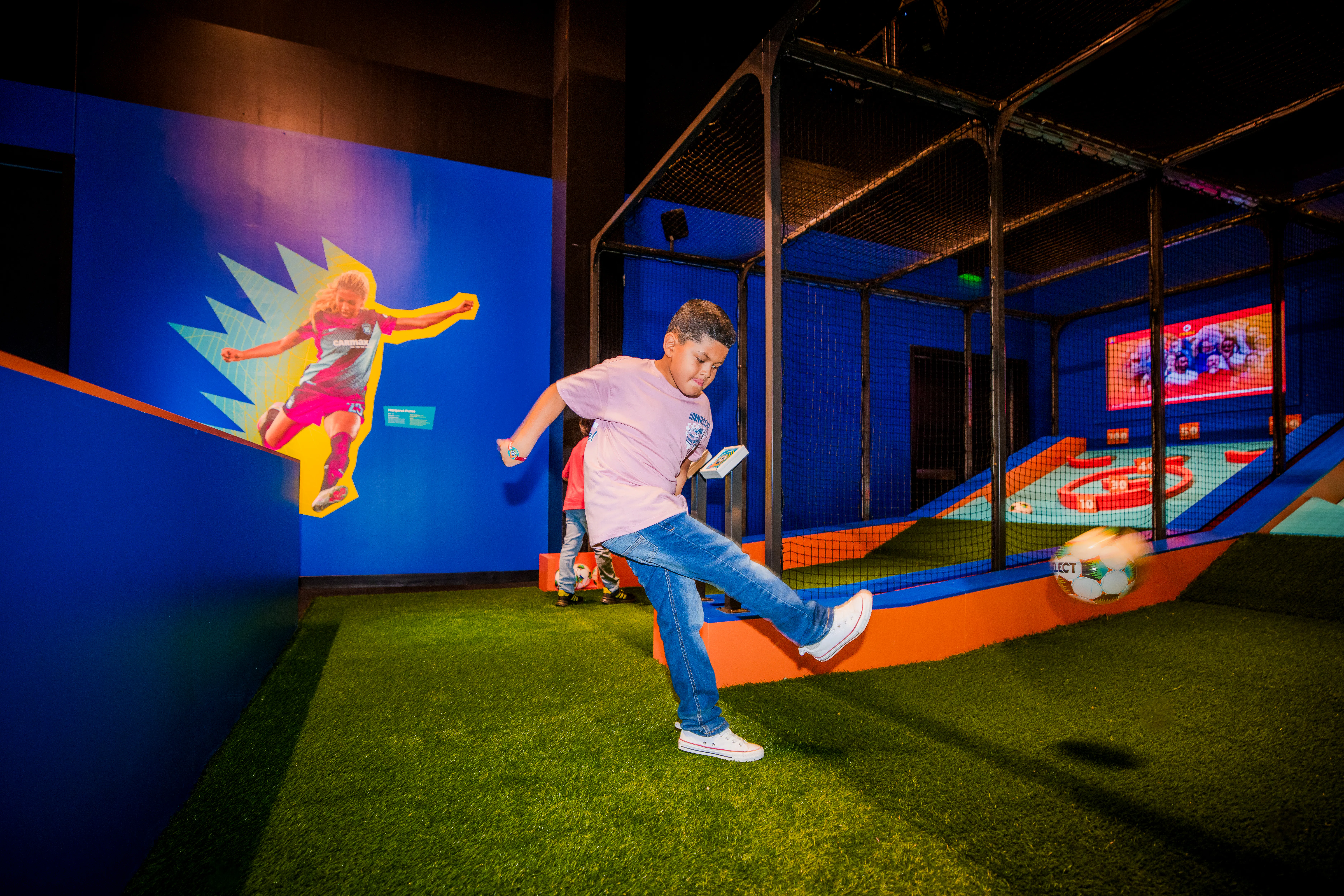 Boy kicking soccer ball