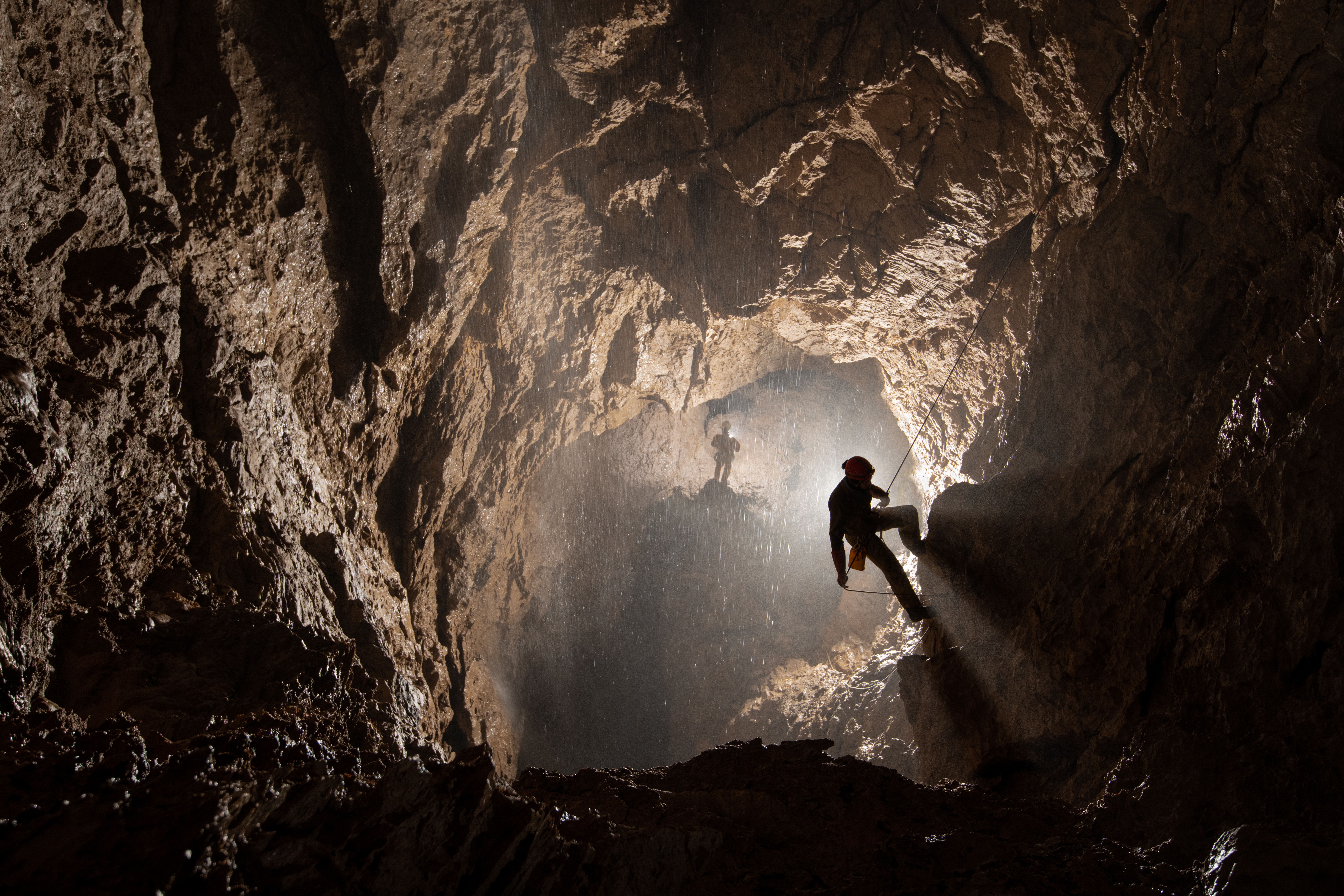 View of person cave diving