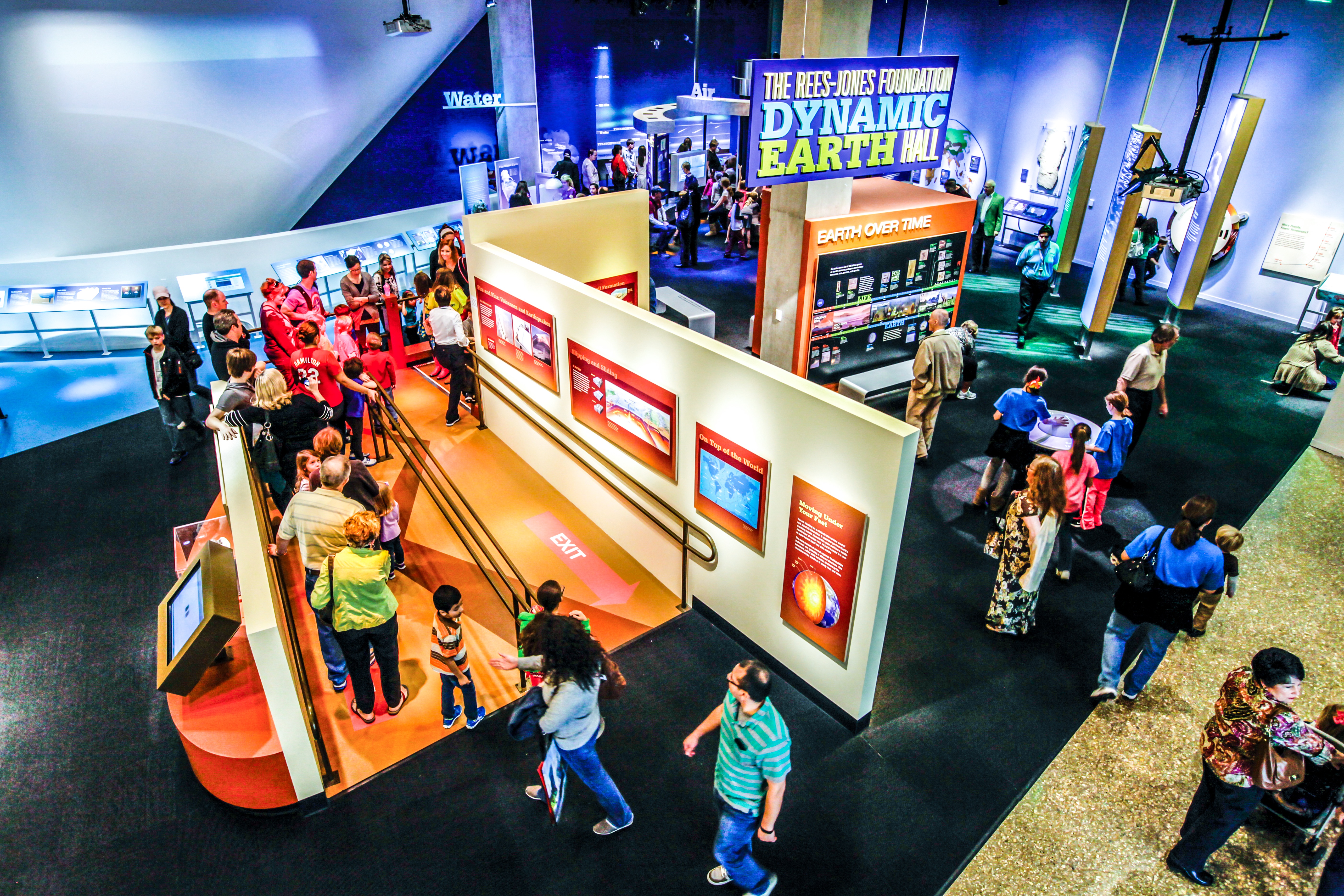 visitors exploring the dynamic earth exhibit