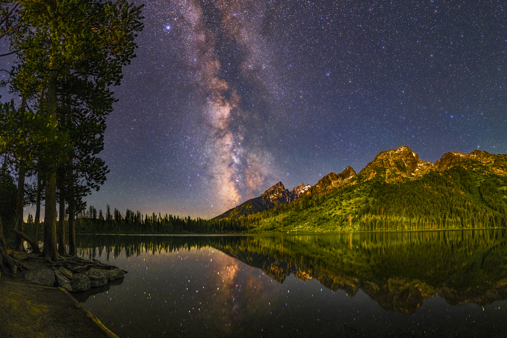 Photo of a landscape underneath a dark sky with purple accents