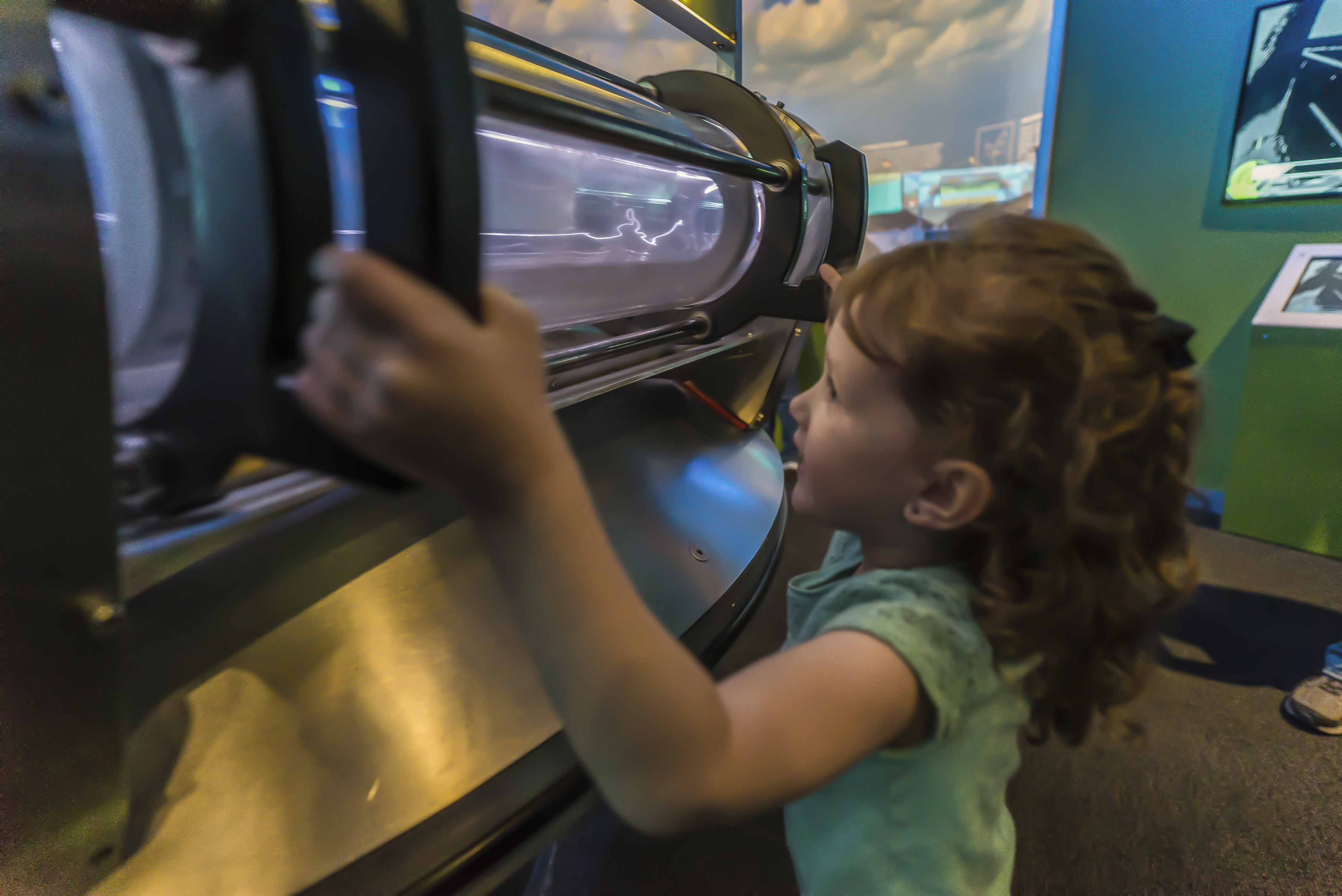 A young girl engages with the museum display.
