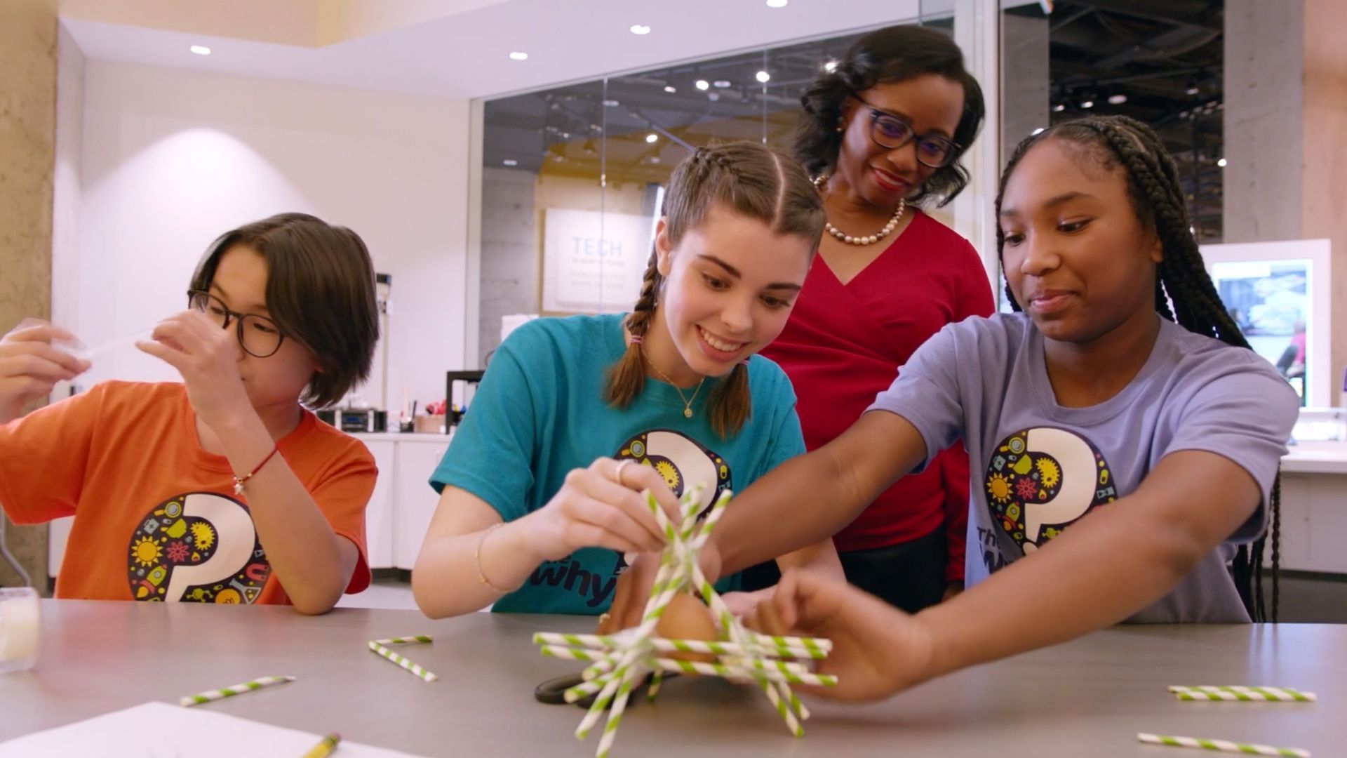 Kids constructing straws