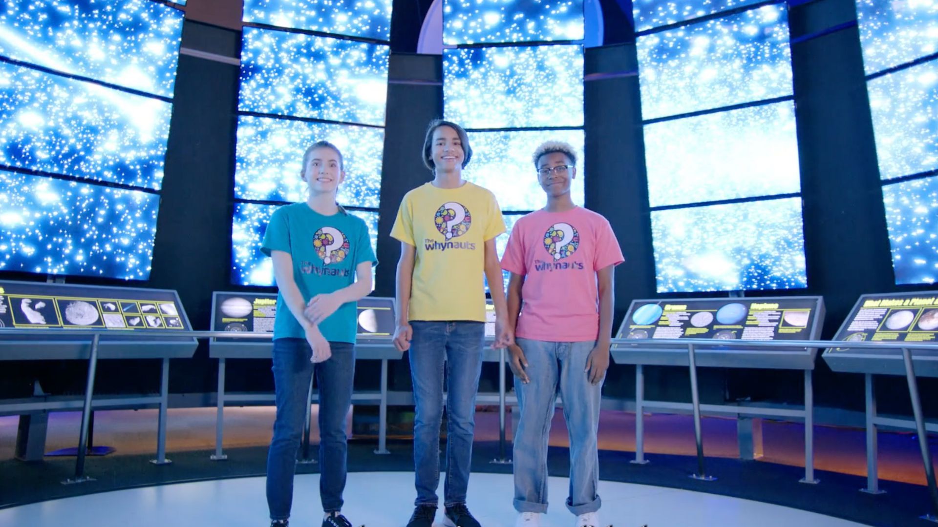 Kids in front of universe screens at Perot Museum