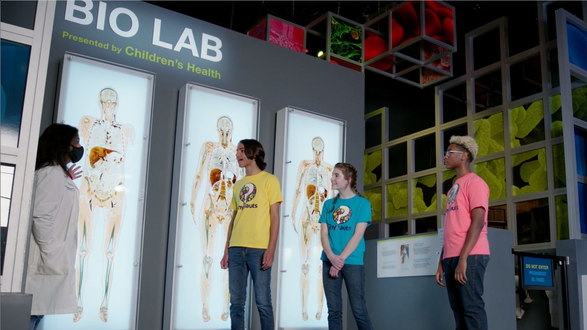 Kids talking to doctor in Perot Museum Bio Lab