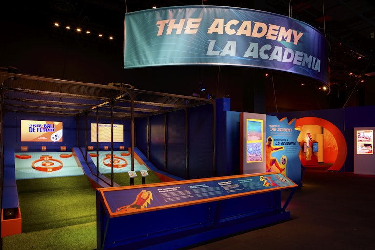 Skeeball interactive station with sign above reading 