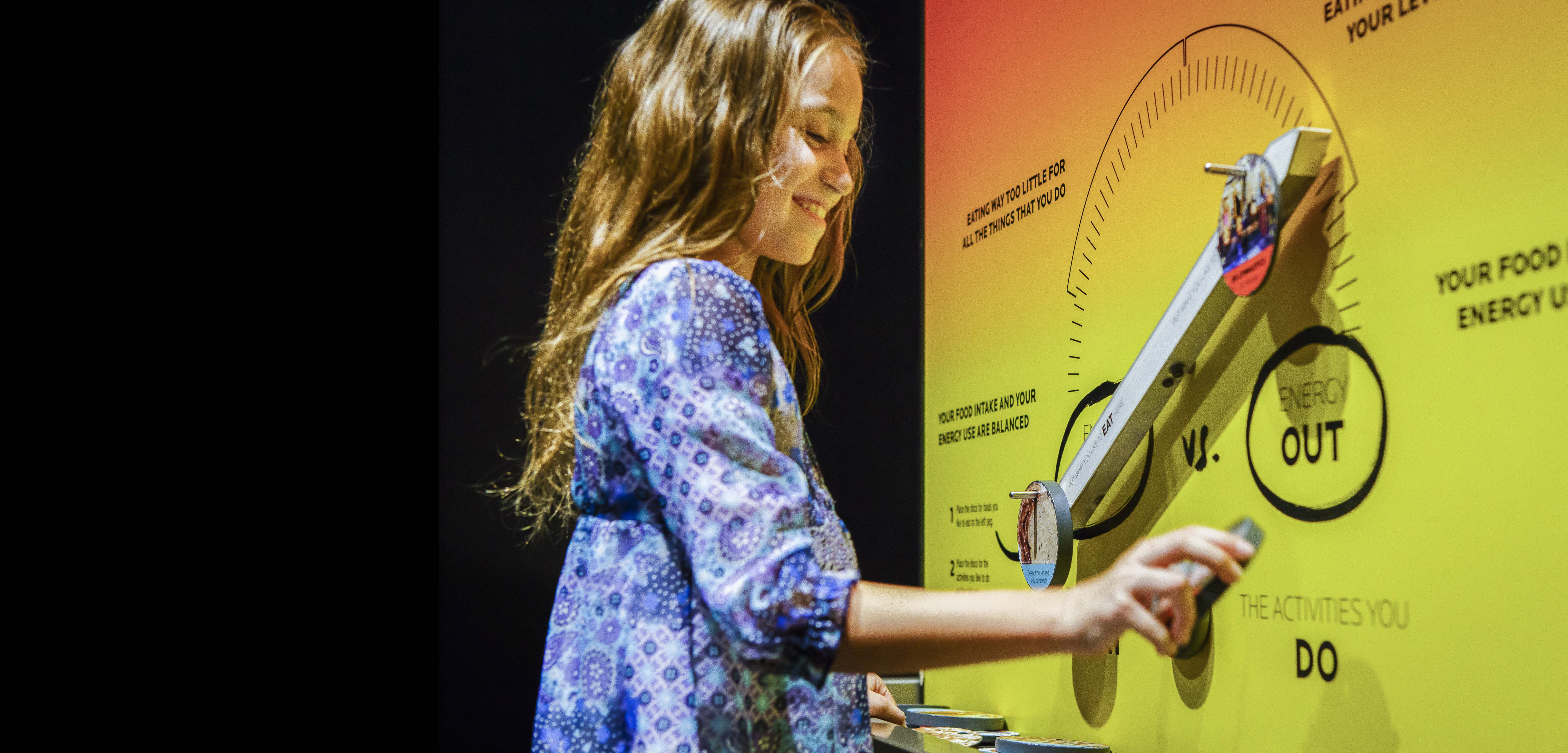 A young girl learning about exercise, diet, and training habits.