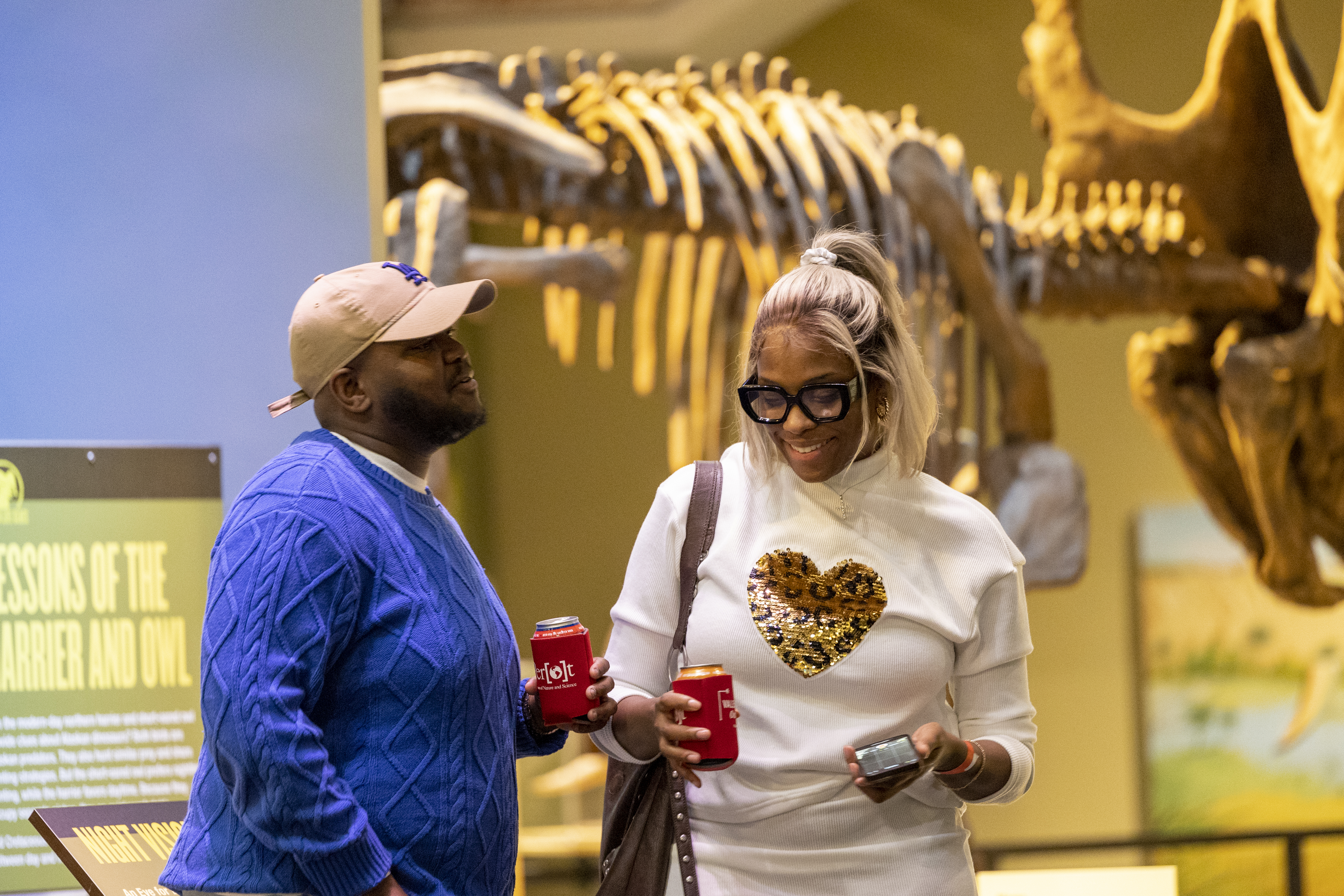 Couple holding drinks