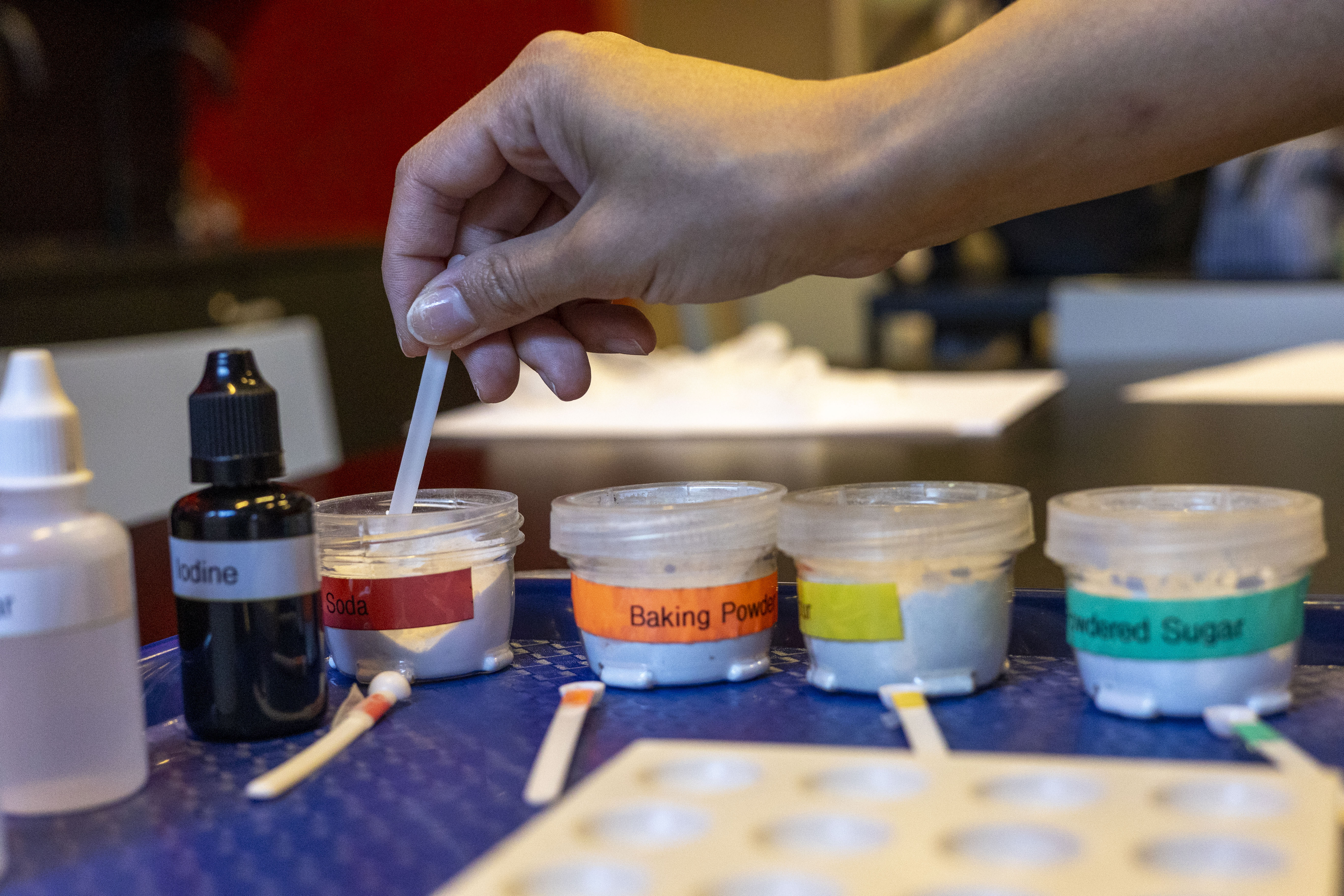 kid performing chemistry experiment