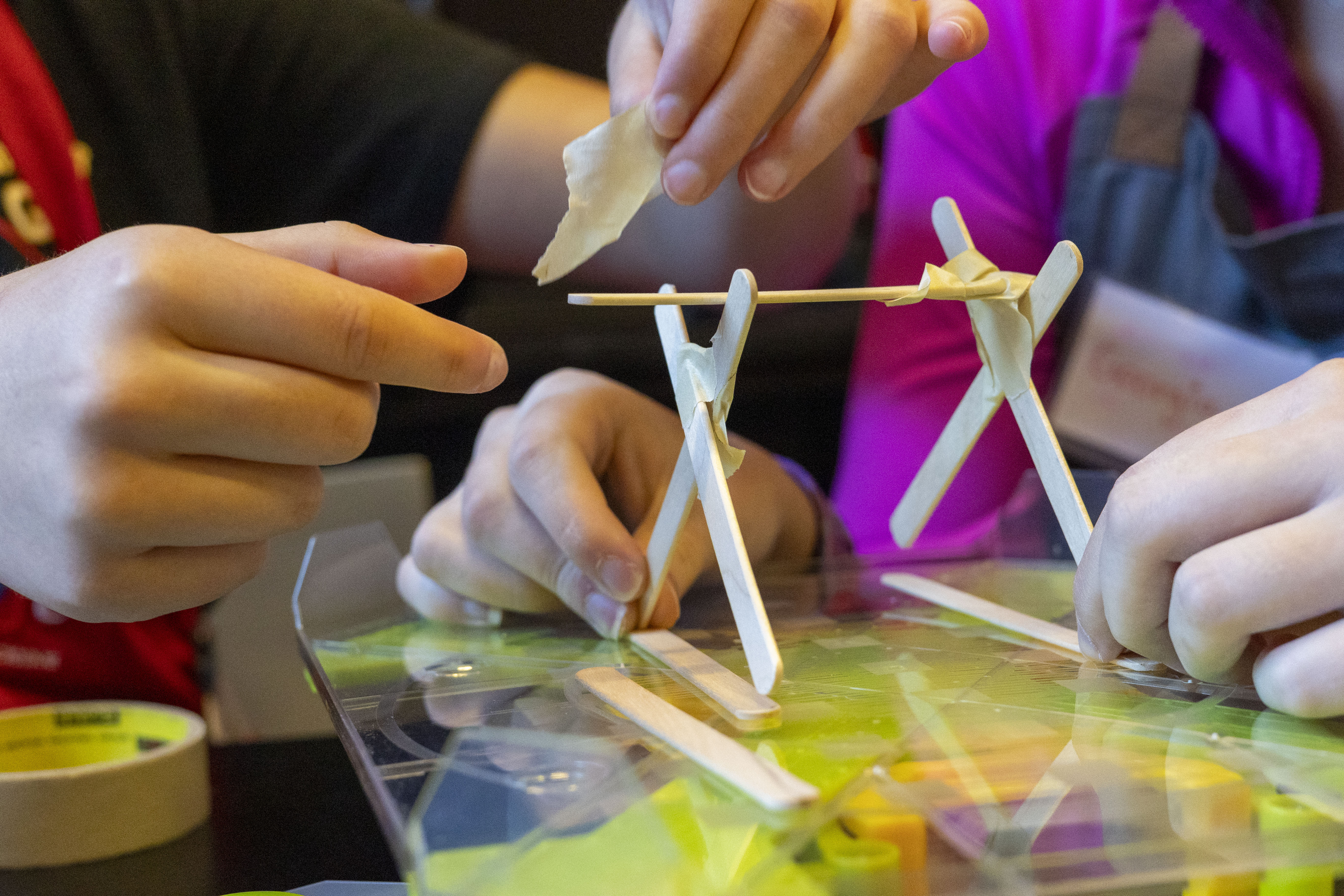 kids performing engineering lab