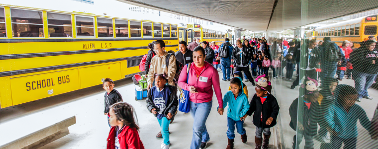 Children outside of school bus at the Perot