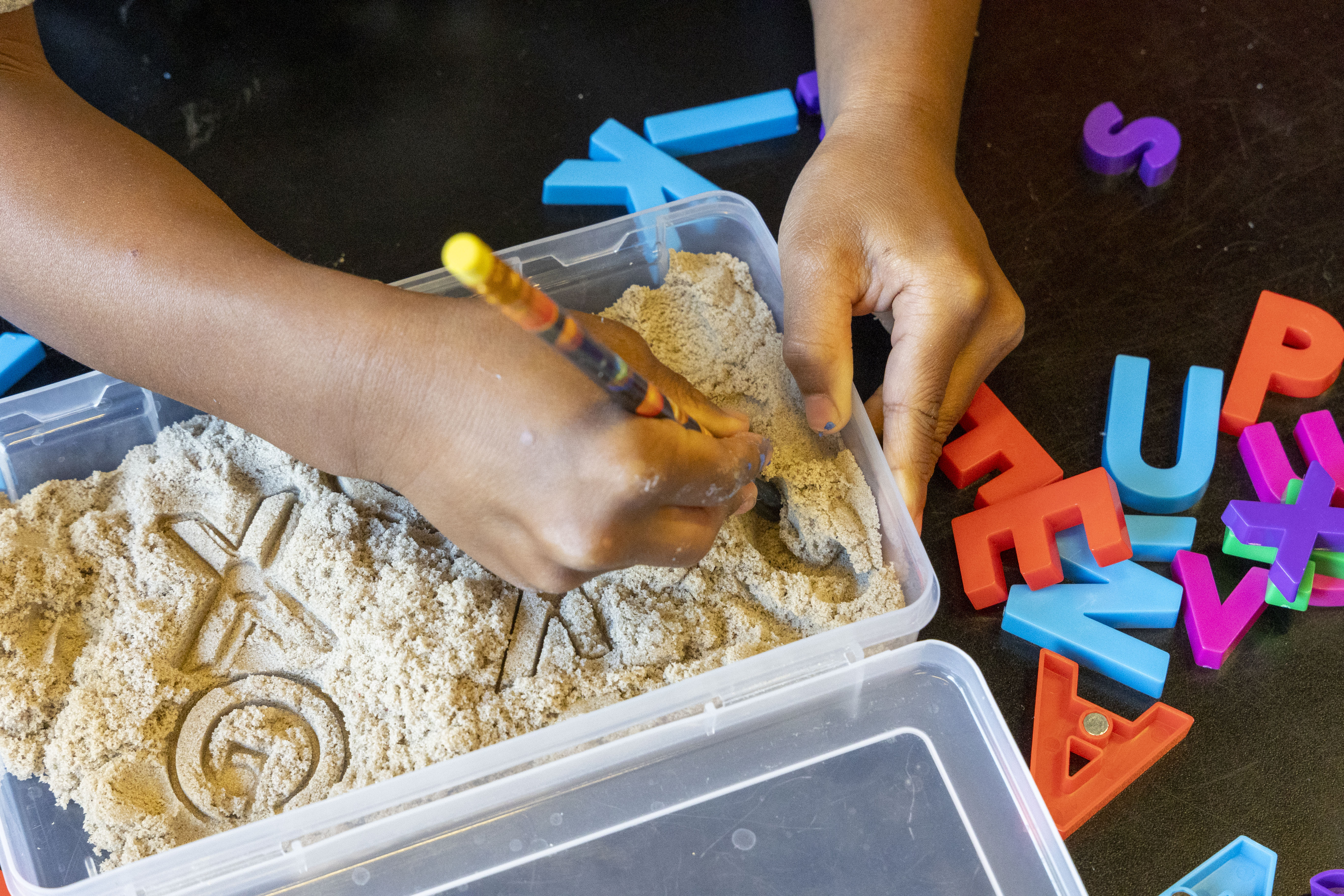 kid performing space explorers lab