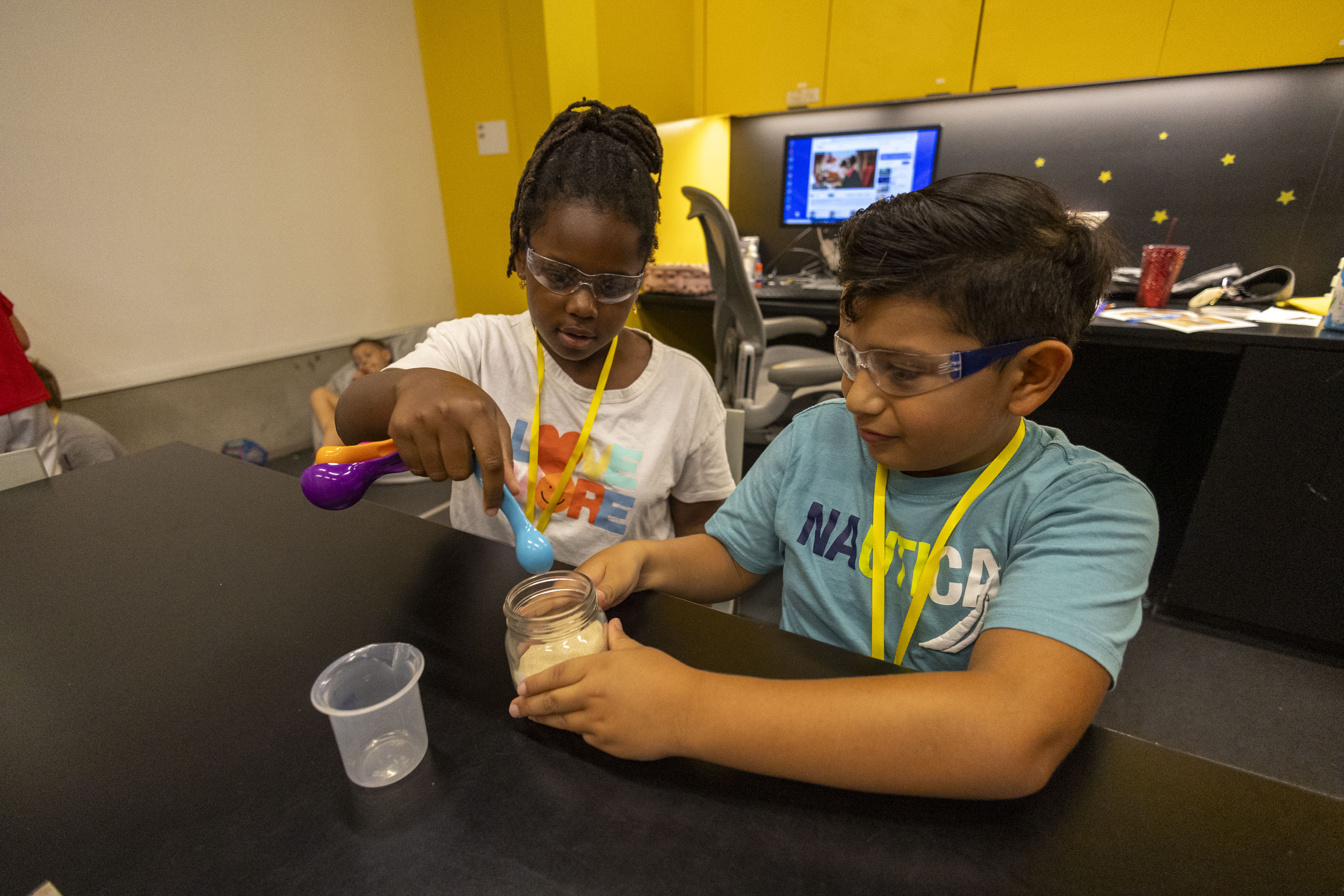 kids performing matter camp experiment
